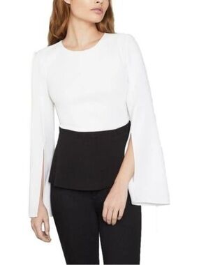 BCBGMaxAzria White Top with Black Peplum and Split Bell Sleeves